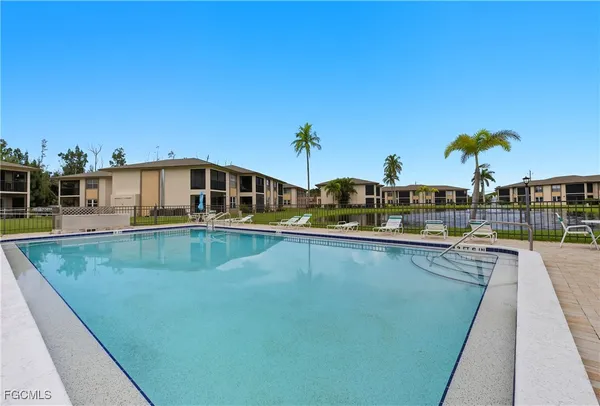 a view of a swimming pool with a deck