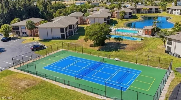 an aerial view of a house with swimming pool