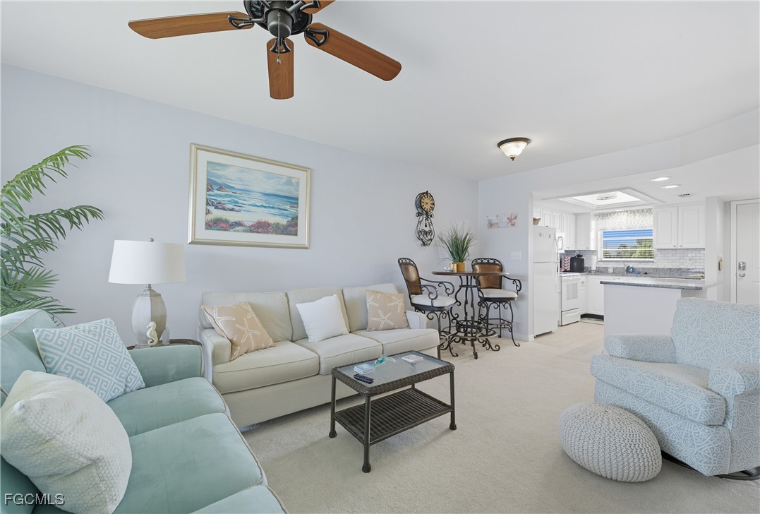 16881 Davis Road, Unit 126 Fort Myers, FL 33908 - Photo 8 of 27 a living room with furniture and kitchen view