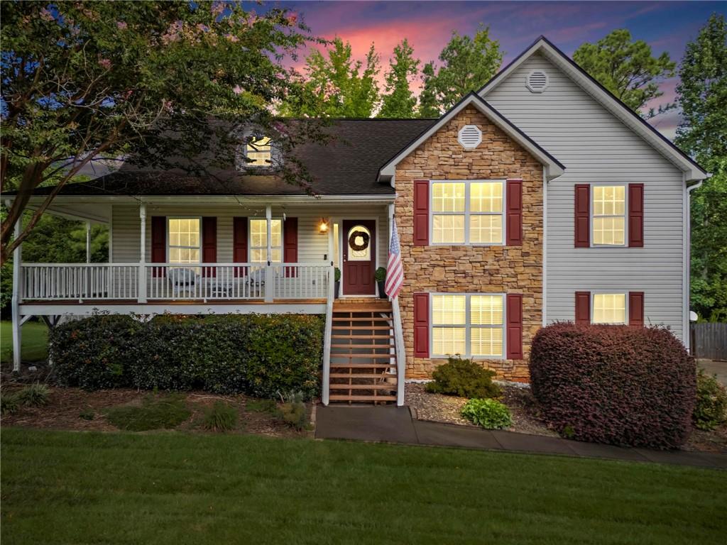 a front view of a house with garden