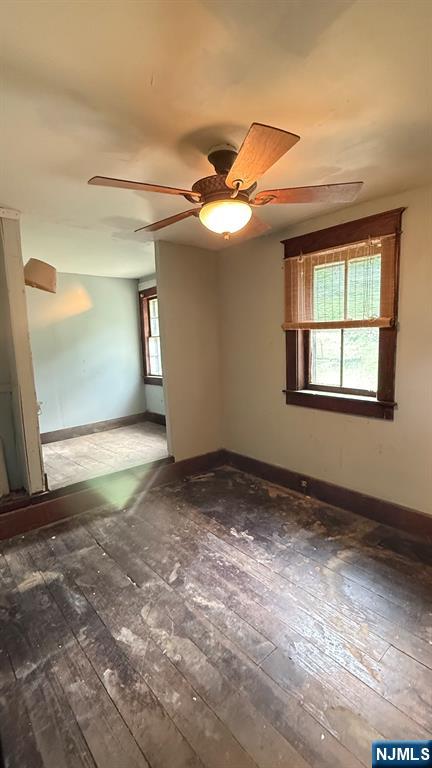25 Coleman Hill Road Washington, NJ 07882 - Photo 16 of 18 an empty room with a chandelier fan and windows