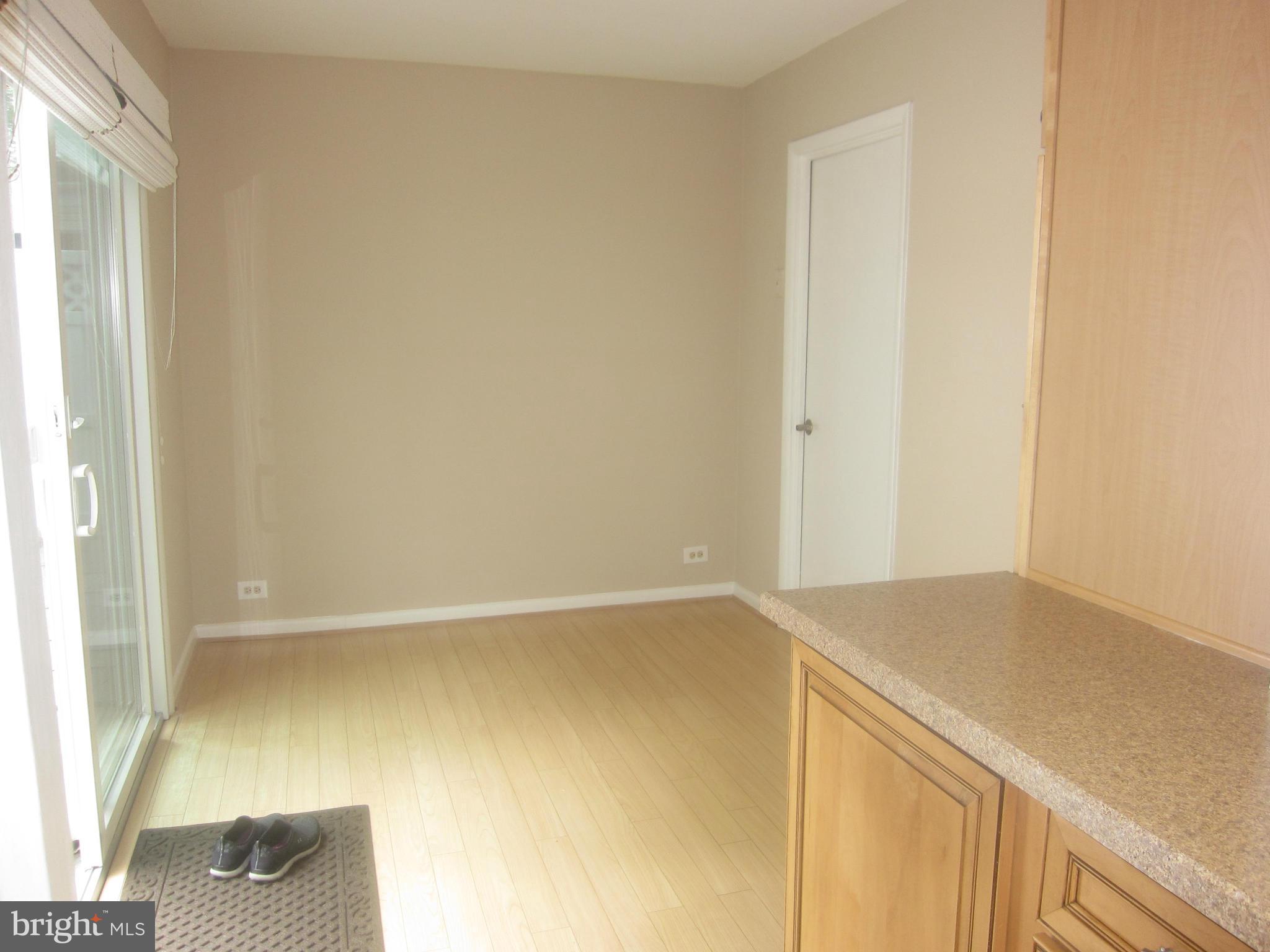 3606 Edelmar Terrace, Unit 128A Silver Spring, MD 20906 - Photo 11 of 30 Den opens to kitchen, patio, garage