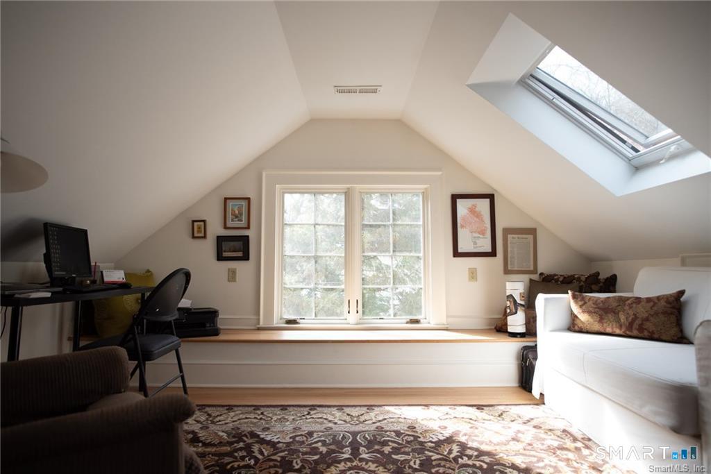 57 Mill Rock Road Hamden, CT 06517 - Photo 19 of 24 a living room with furniture and a window