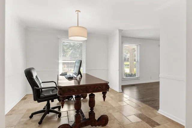 a view of a dining room with furniture and window