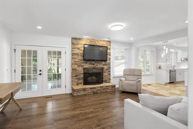 a living room with furniture and a fireplace