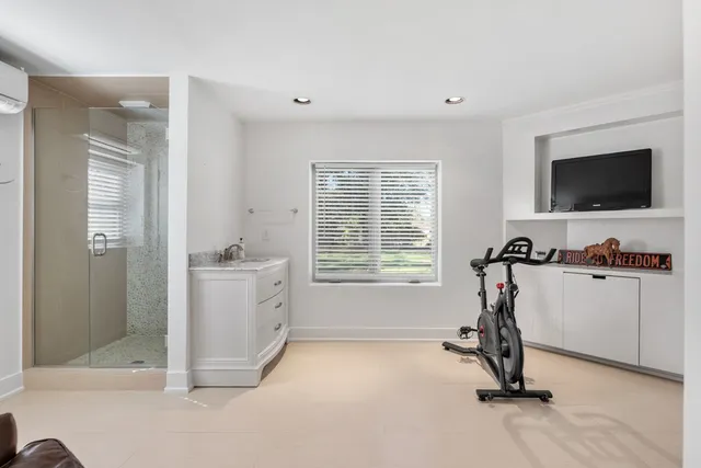 a view of a room with wooden floor