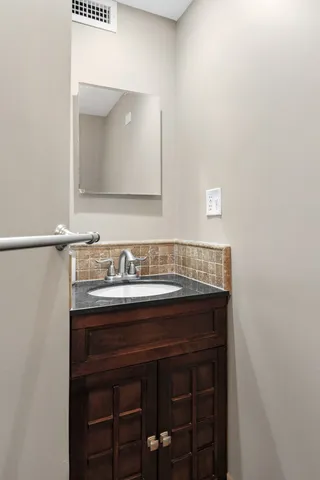 wooden floor in an empty room with a fireplace