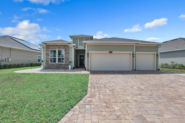 a view of house with yard and entertaining space