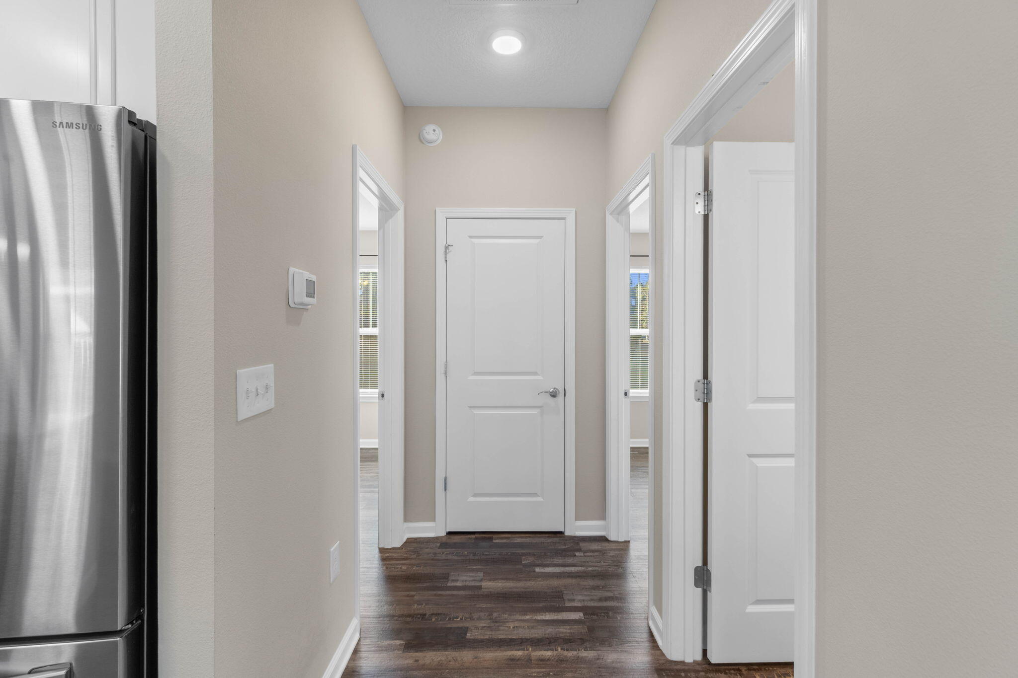 145 4th Avenue Crestview, FL 32539 - Photo 14 of 31 a view of a hallway with wooden floor and staircase
