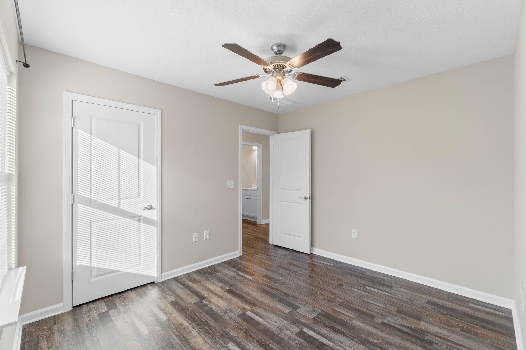145 4th Avenue Crestview, FL 32539 - Photo 16 of 31 a view of an empty room with wooden floor