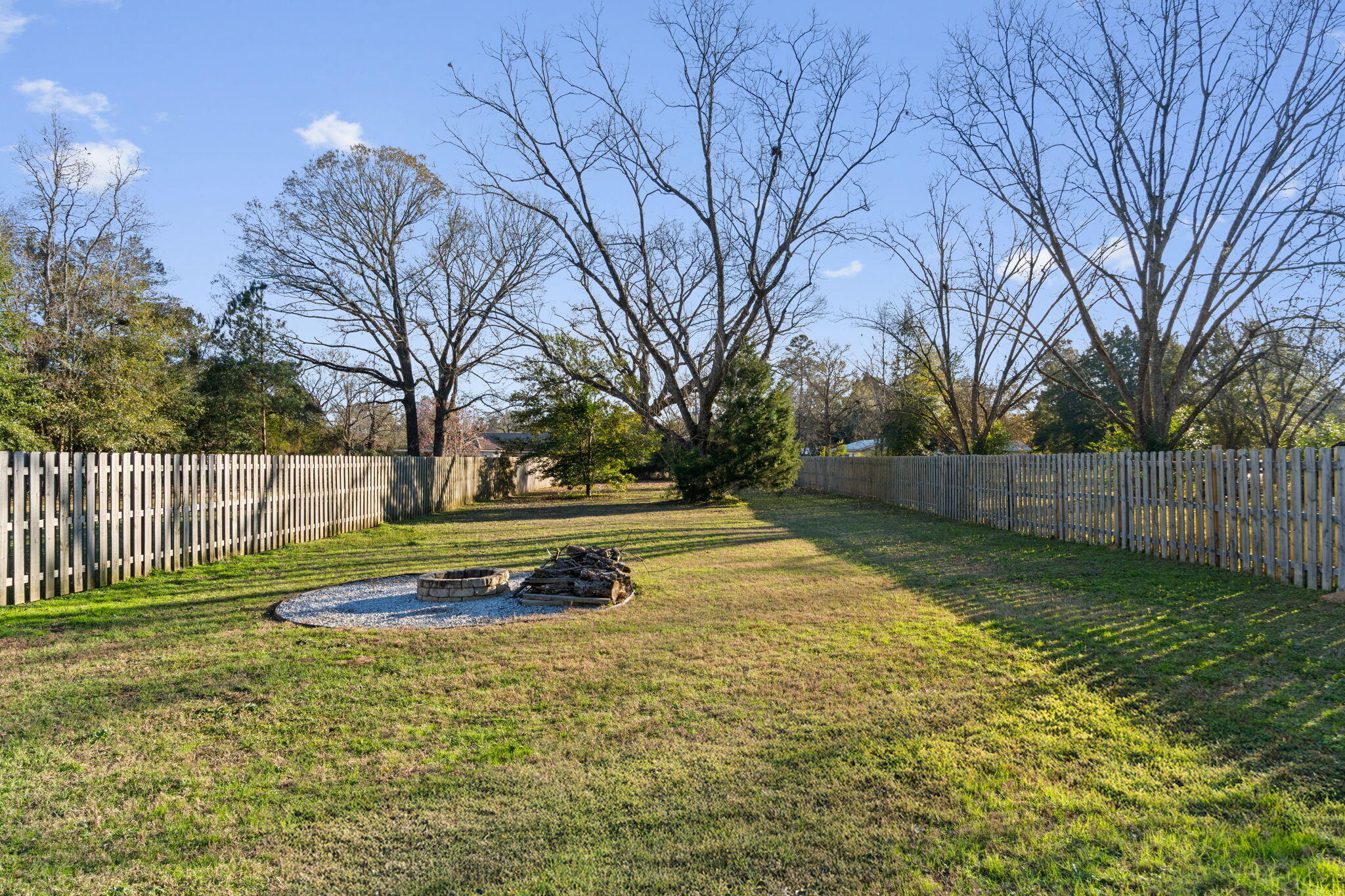 145 4th Avenue Crestview, FL 32539 - Photo 28 of 31 a view of a backyard with large trees