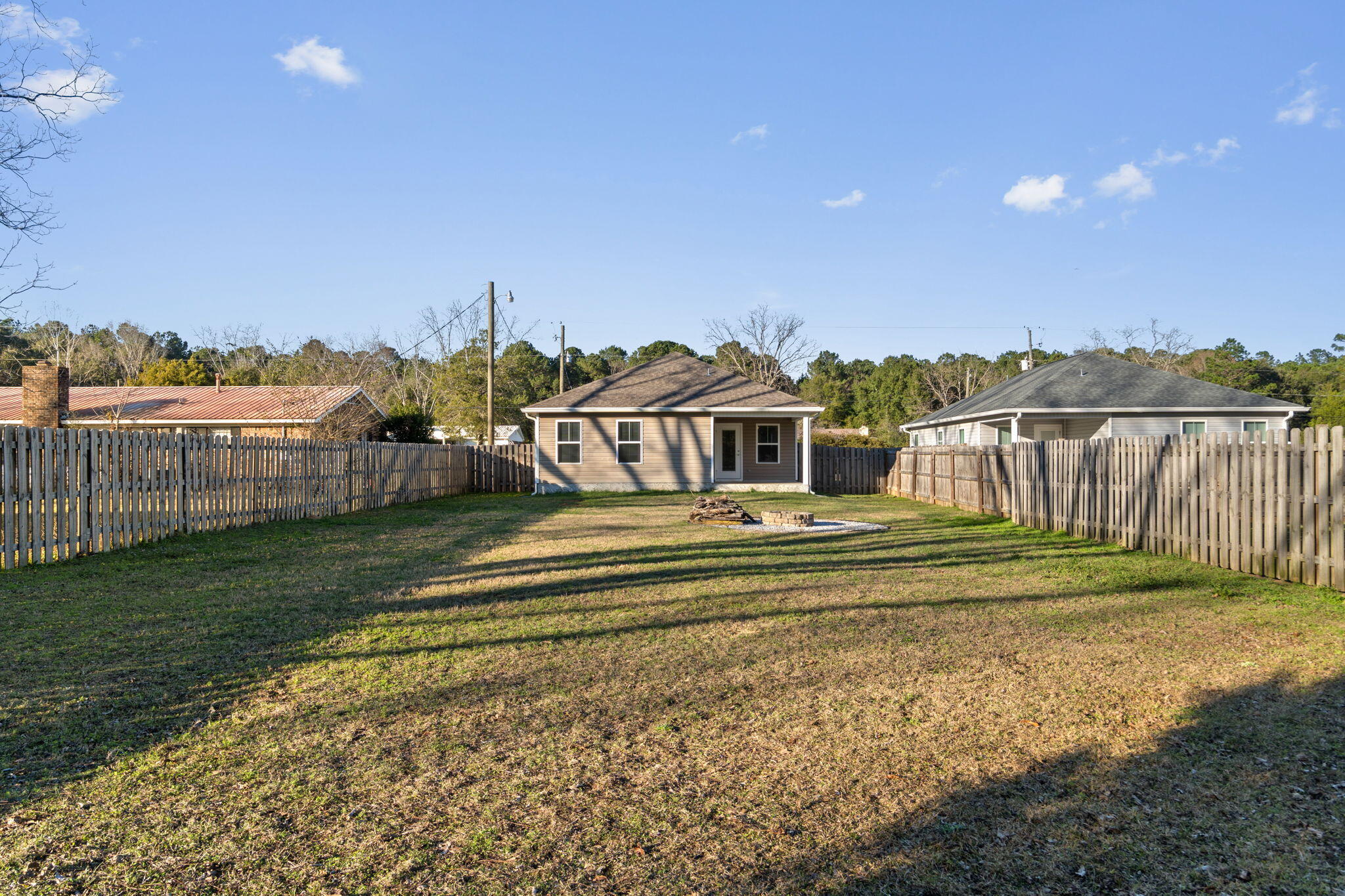 145 4th Avenue Crestview, FL 32539 - Photo 29 of 31 a view of a house with a yard and balcony
