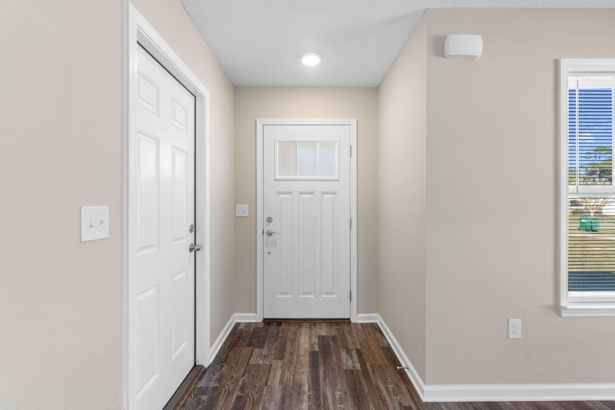 145 4th Avenue Crestview, FL 32539 - Photo 3 of 31 a view of a hallway with wooden floor and a bathroom