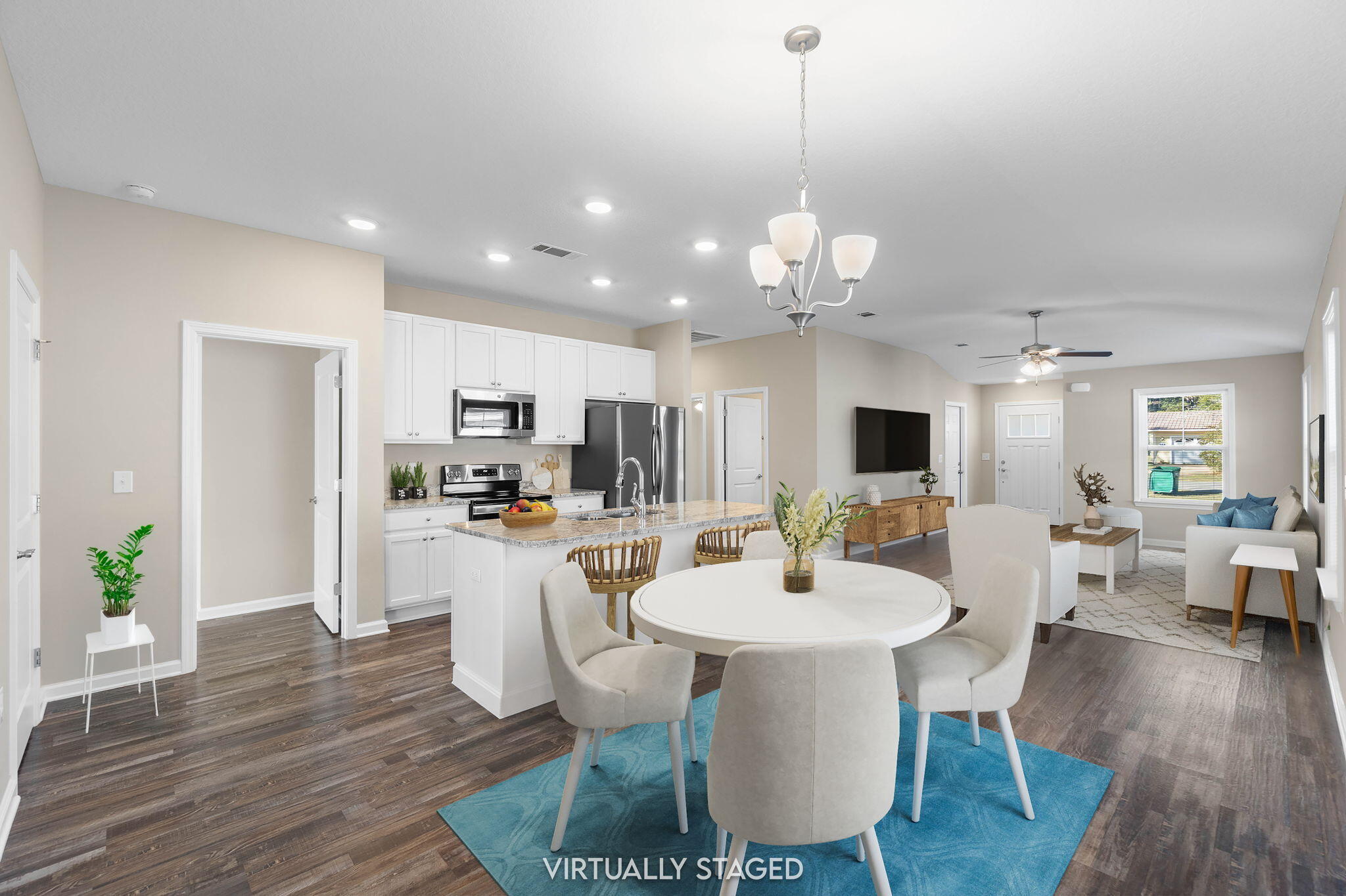 145 4th Avenue Crestview, FL 32539 - Photo 9 of 31 a dining room with wooden floor a chandelier a glass table and chairs