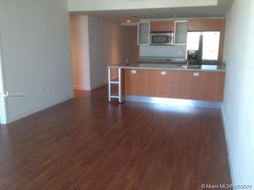 185 Southwest 7th Street, Unit 3403 Miami, FL 33130 - Photo 5 of 34 a view interior of the house with wooden floor