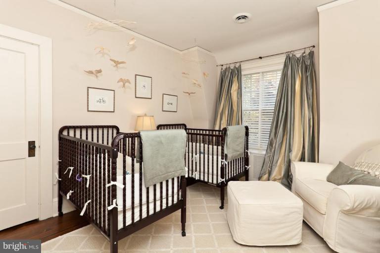 108 Longwood Road Baltimore, MD 21210 - Photo 2 of 28 a bedroom with a bed and a window