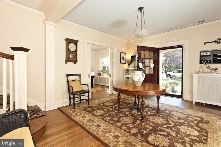 108 Longwood Road Baltimore, MD 21210 - Photo 17 of 28 a living room with furniture a window and a table