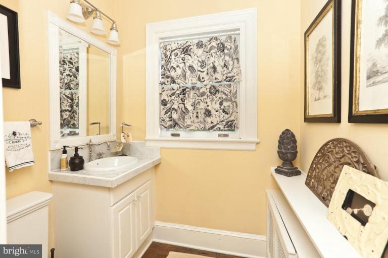 108 Longwood Road Baltimore, MD 21210 - Photo 20 of 28 a bathroom with a sink and a bathtub