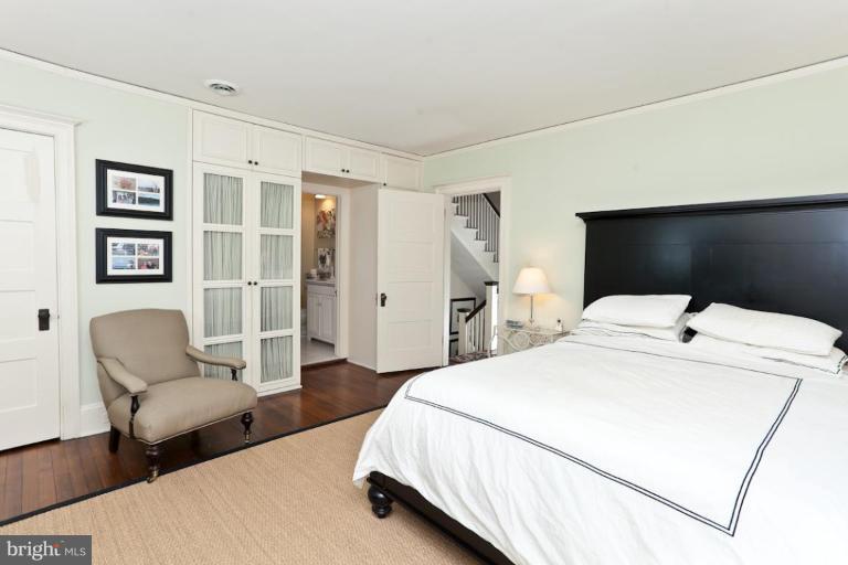 108 Longwood Road Baltimore, MD 21210 - Photo 4 of 28 a spacious bedroom with a bed and furniture