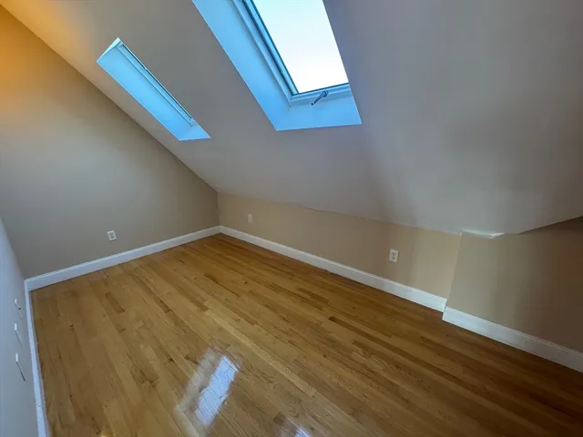 a view of a room with wooden floor and staircase