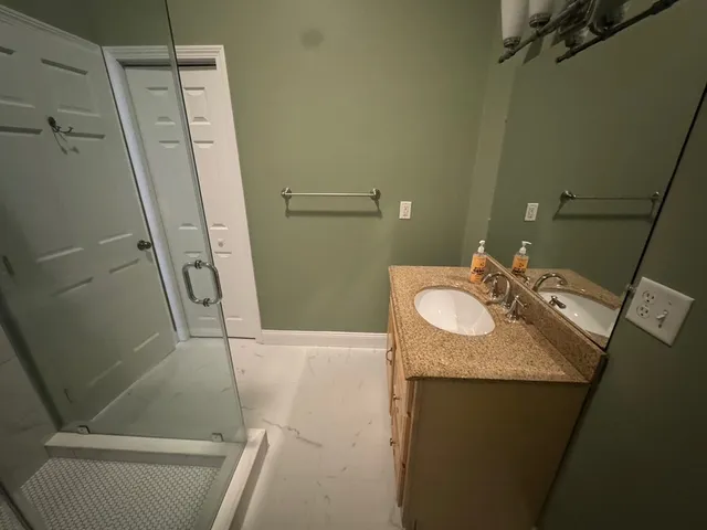 a view of a chairs and a fire pit in the back yard