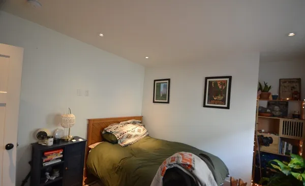 a bedroom with a bed and furniture