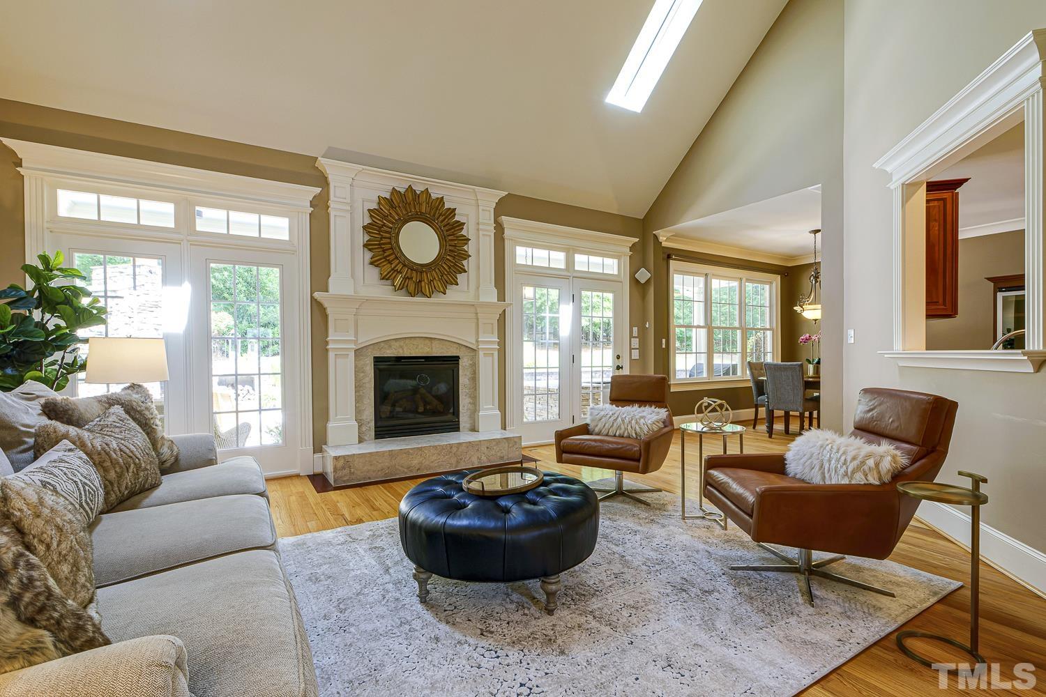 5201 Rathkeale Court Holly Springs, NC 27540 - Photo 11 of 46 a living room with furniture and a large window