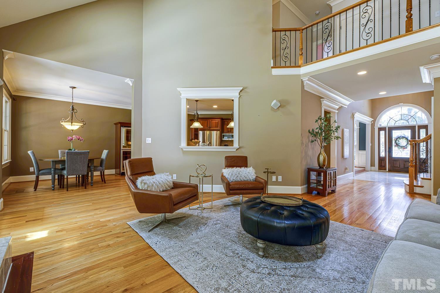 5201 Rathkeale Court Holly Springs, NC 27540 - Photo 13 of 46 a living room with furniture and a wooden floor