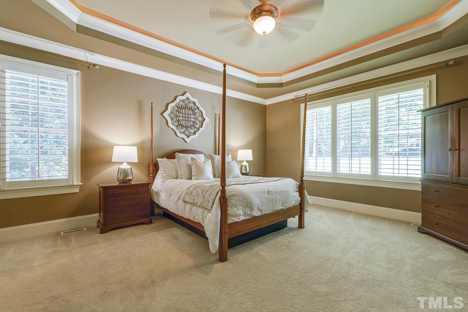 5201 Rathkeale Court Holly Springs, NC 27540 - Photo 20 of 46 a spacious bedroom with a bed and window