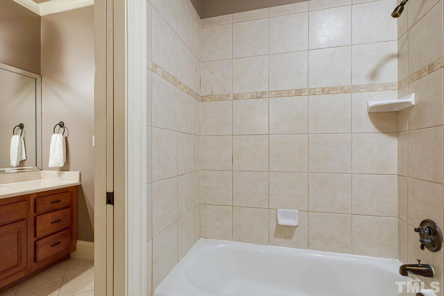 5201 Rathkeale Court Holly Springs, NC 27540 - Photo 32 of 46 a bathroom with a shower