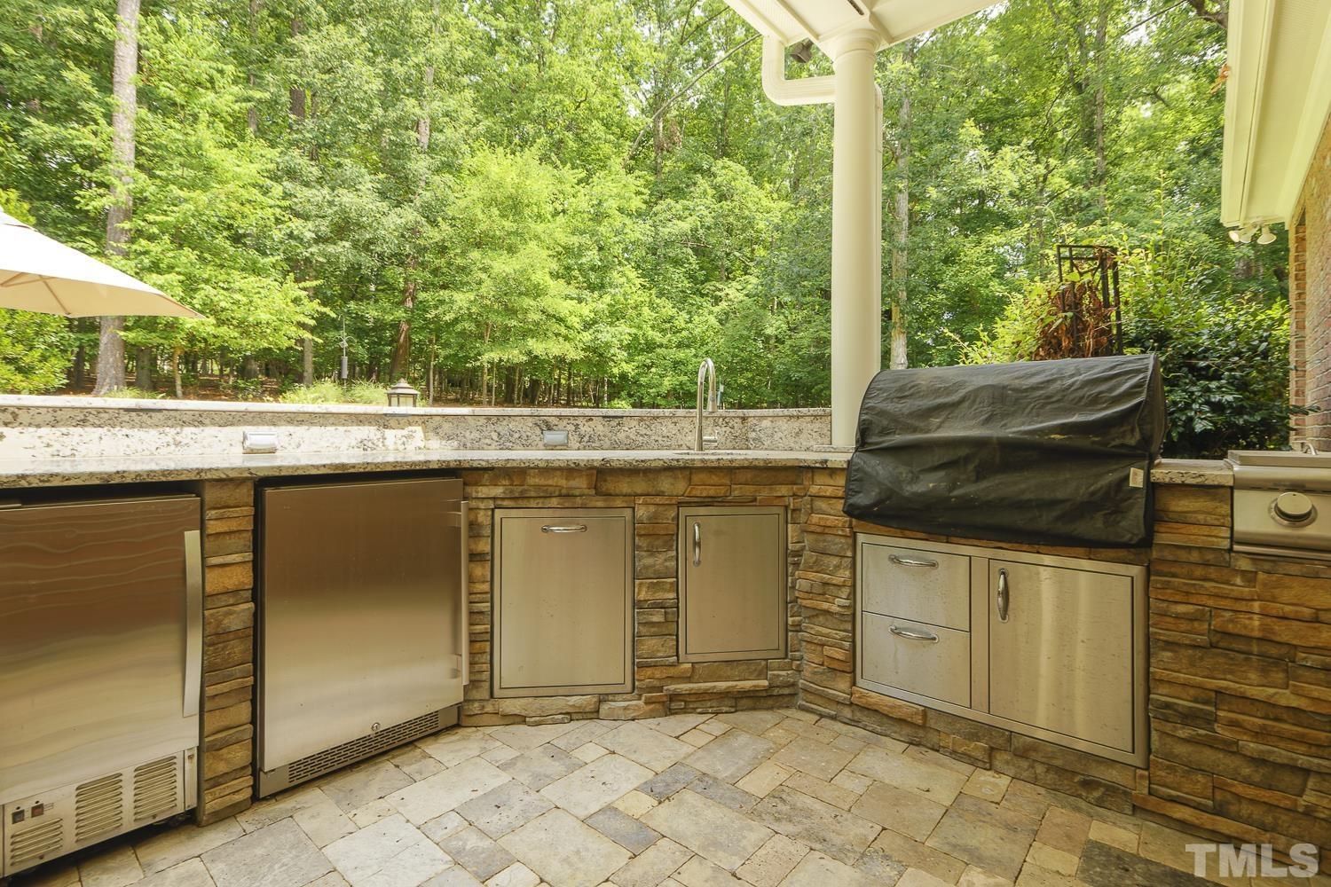 5201 Rathkeale Court Holly Springs, NC 27540 - Photo 34 of 46 a view of a terrace with a garden