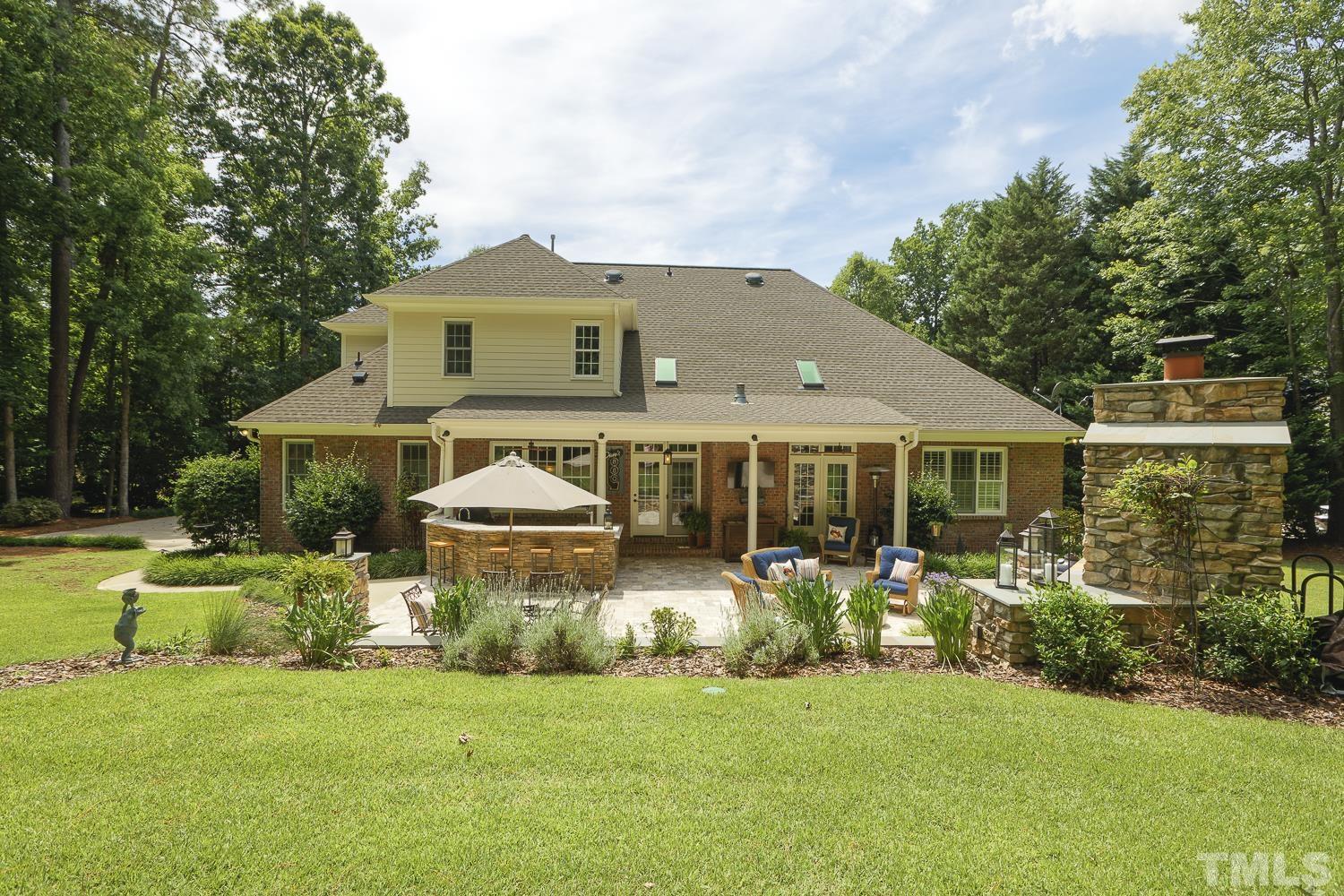 5201 Rathkeale Court Holly Springs, NC 27540 - Photo 40 of 46 a front view of a house with a garden and plants