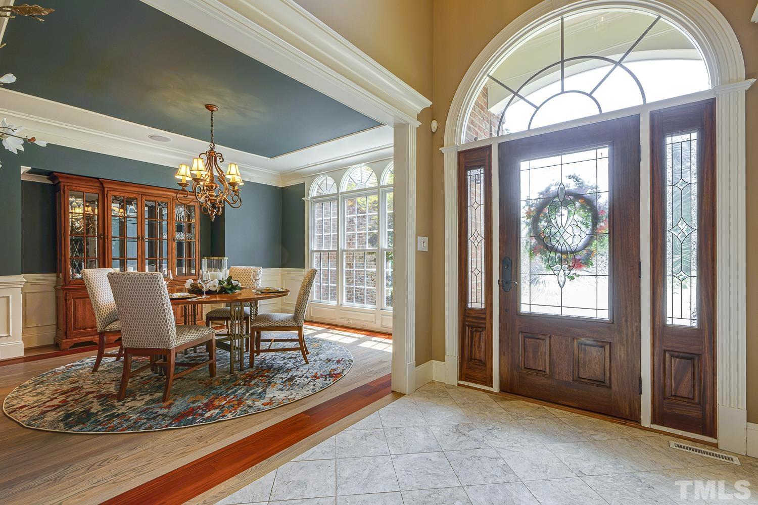 5201 Rathkeale Court Holly Springs, NC 27540 - Photo 4 of 46 a view of a dining room with furniture window and outside view