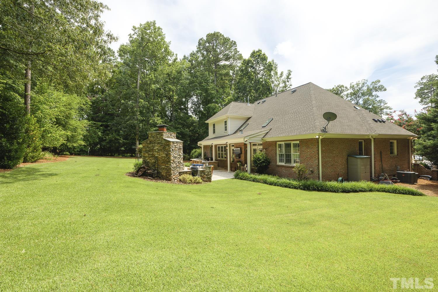 5201 Rathkeale Court Holly Springs, NC 27540 - Photo 42 of 46 a view of a house with a yard and sitting area
