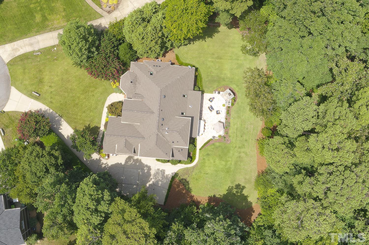 5201 Rathkeale Court Holly Springs, NC 27540 - Photo 44 of 46 an aerial view of residential house with pool and yard