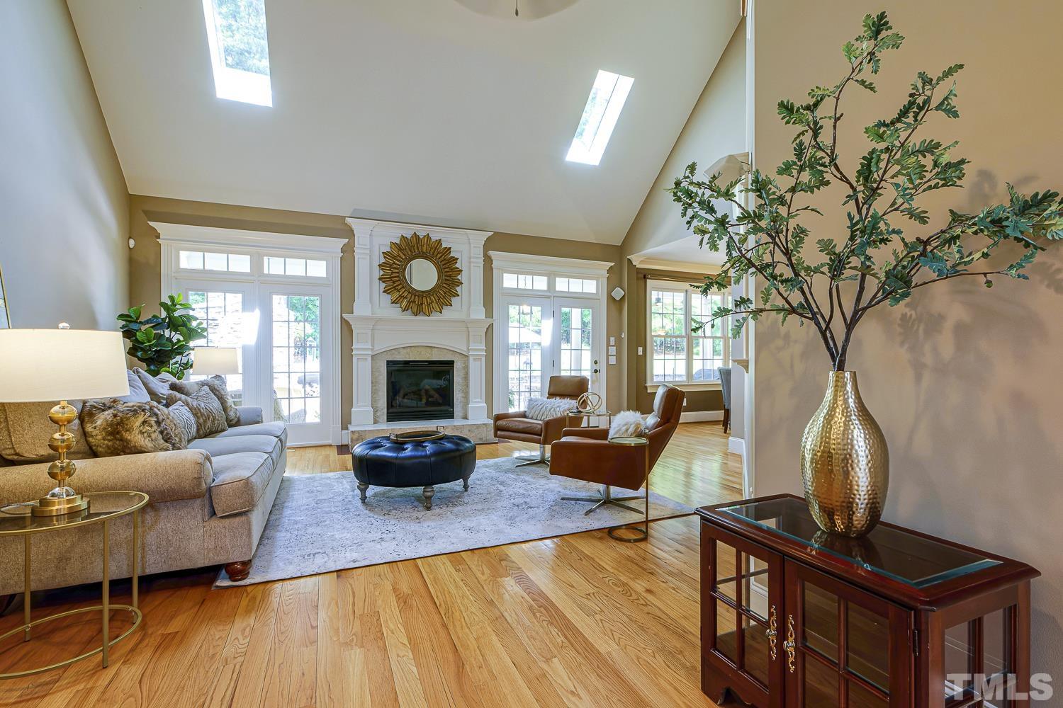 5201 Rathkeale Court Holly Springs, NC 27540 - Photo 10 of 46 a living room with furniture fireplace and a large window