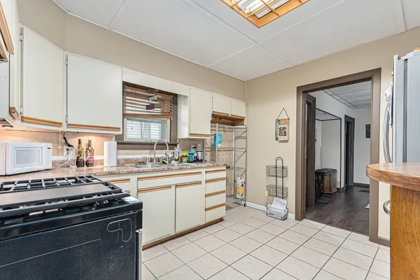 a kitchen with a stove and a refrigerator