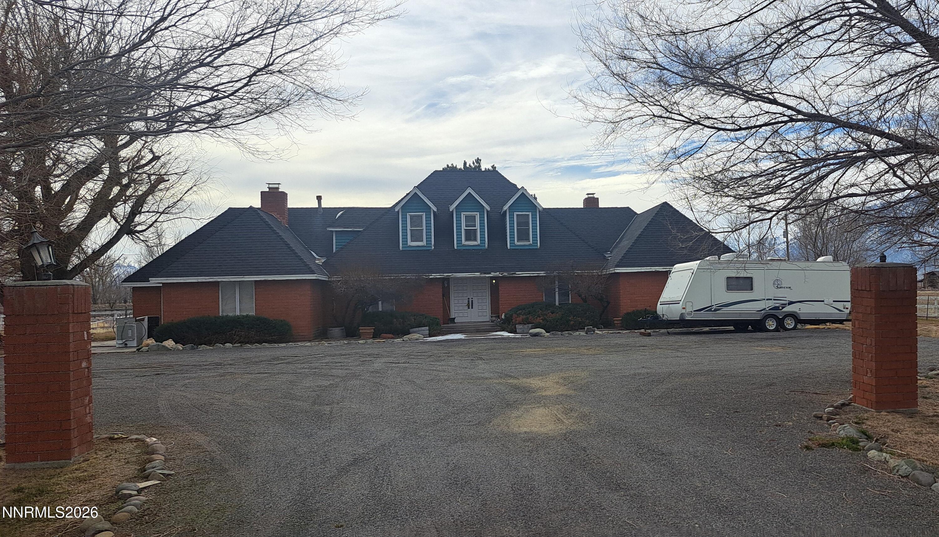 a view of a house with a yard