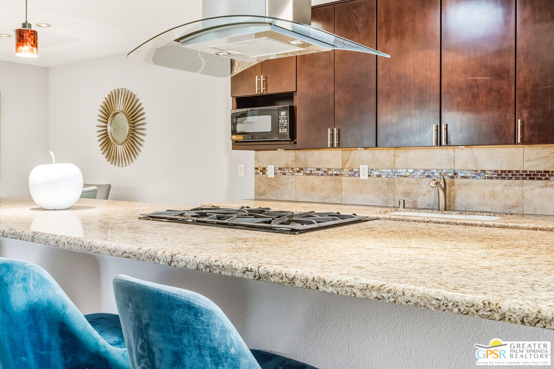 1103 East Alejo Road Palm Springs, CA 92262 - Photo 16 of 39 a bathroom with a granite countertop sink and a mirror