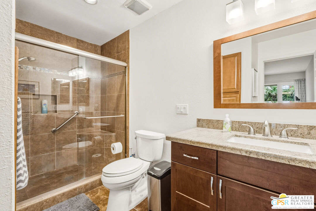 1103 East Alejo Road Palm Springs, CA 92262 - Photo 24 of 39 a bathroom with a sink a toilet and shower