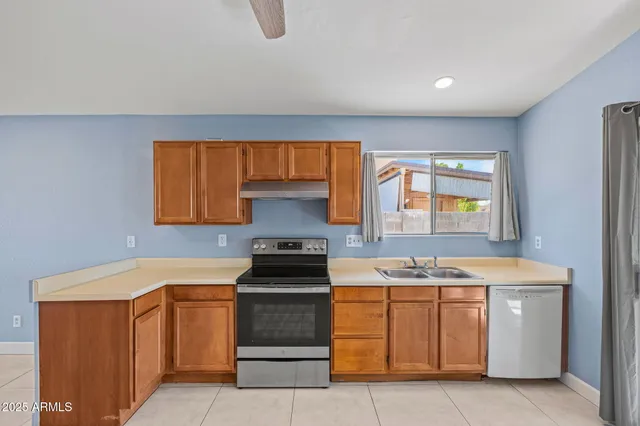 a kitchen with a stove and a sink