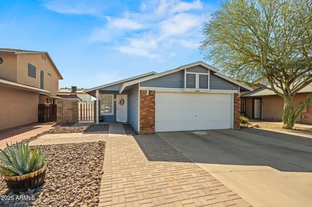 a front view of a house with a garage