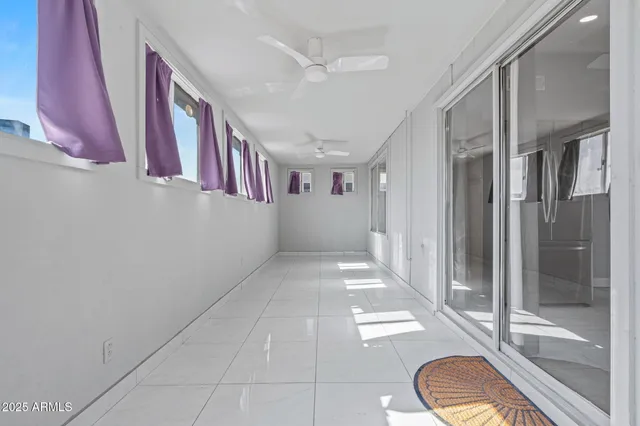 a view of a hallway with windows