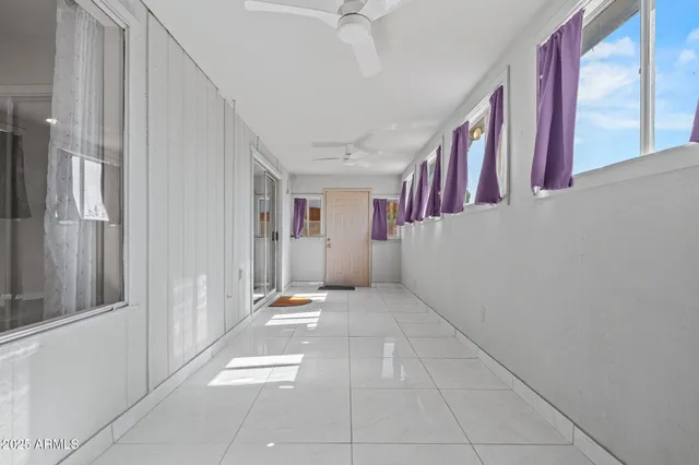 a view of a house with a wooden fence