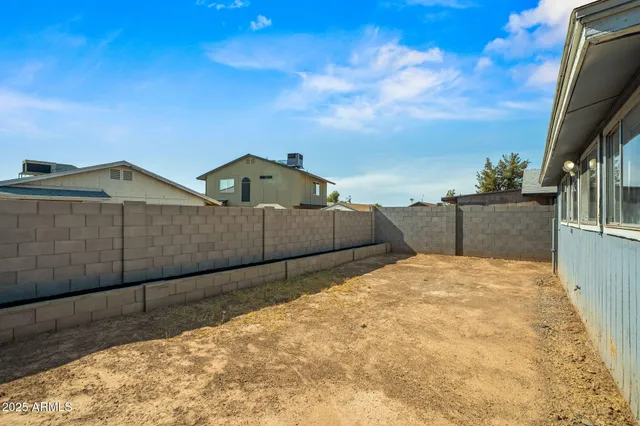 a view of wooden fence and outside space