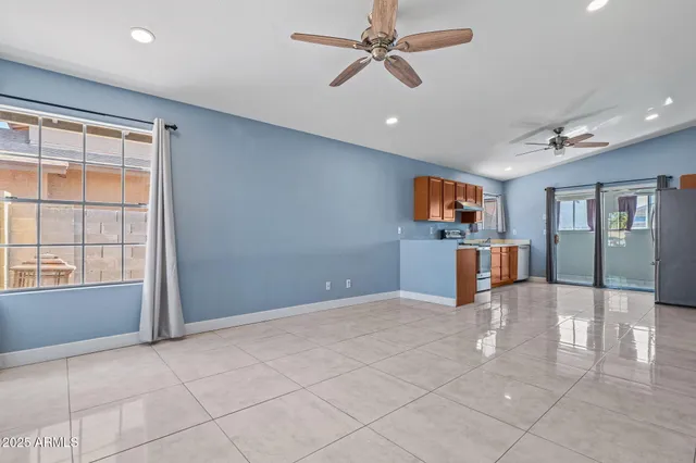 a view of a kitchen with furniture and windows