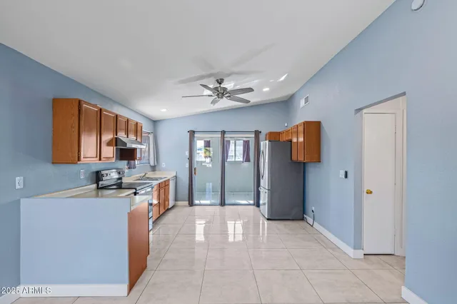 a view of a kitchen with a sink cabinet and a living room