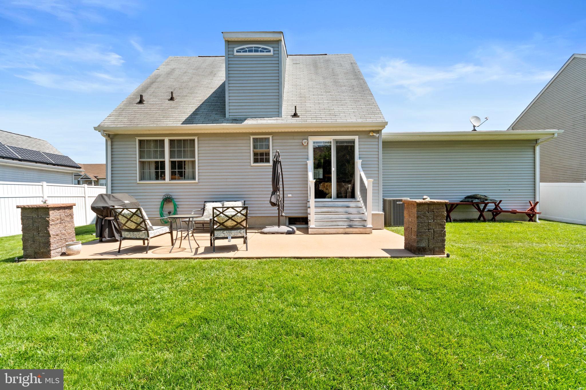 93 Weathervane Drive Mount Royal, NJ 08061 - Photo 20 of 22 a front view of a house with patio and yard