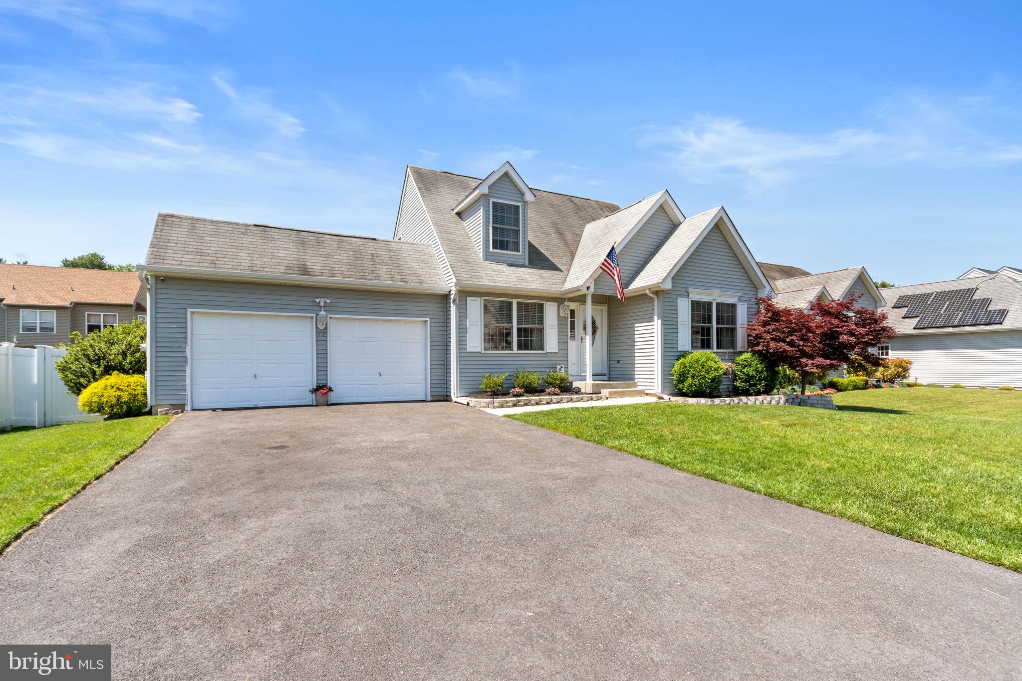 93 Weathervane Drive Mount Royal, NJ 08061 - Photo 22 of 22 a front view of a house with a yard and garage
