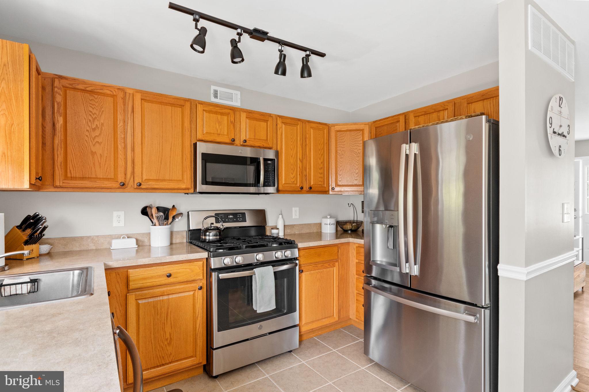 93 Weathervane Drive Mount Royal, NJ 08061 - Photo 5 of 22 a kitchen with stainless steel appliances granite countertop a refrigerator a stove top oven a sink and dishwasher